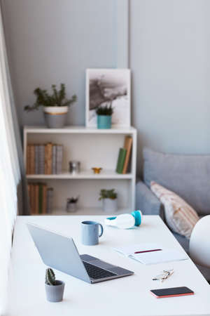 Vertical background image of home office workplace with laptop, copy space