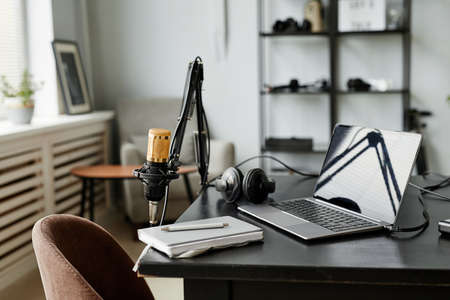 Background image of recording studio interior with microphone on stand, copy space