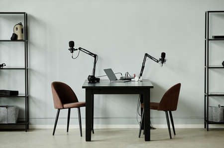 Minimal background image of podcast recording studio with two chairs, copy spaceの写真素材
