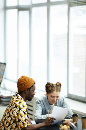 Minimal portrait of creative young entrepreneurs in business meeting together, copy space