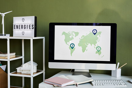 Close-up of computer monitor with map on the screen standing on table at office
