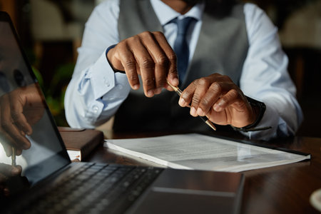 Close-up of African American businessman discussing business contract at meetingの写真素材