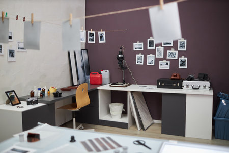 Photo studio with special professional equipment and printed photos on the wallの写真素材