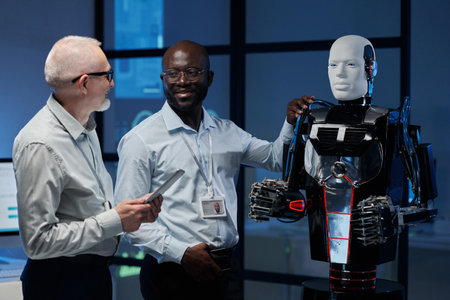 Multiethnic engineers discussing artificial intelligence of robot during their work in labの写真素材