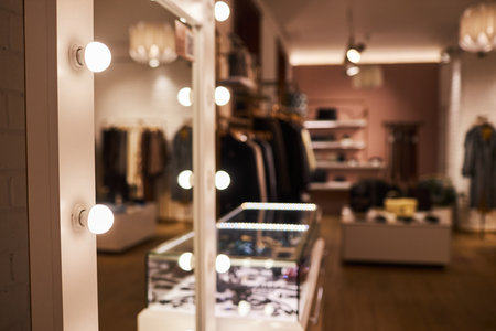 Background image of big vanity mirror in clothing boutique interior, copy spaceの写真素材