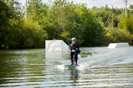 Portrait of young man with disability doing extreme water sports with adaptive equipment, copy space