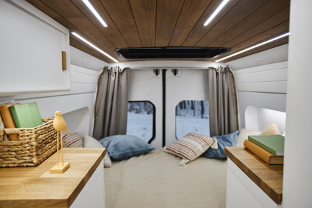 Background image of trailer van interior with bed and decor items, copy spaceの写真素材