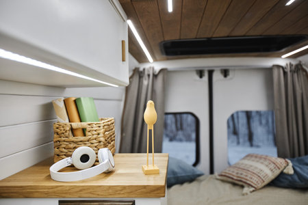 Close up of headphones and decor items on shelf in trailer van interior, copy spaceの写真素材
