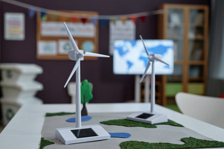 Close up of wind turbine models and clean energy in preschool class, copy space