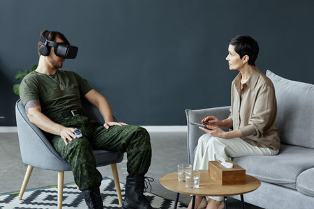 Minimal portrait of army veteran using VR technology in mental health session with female therapist...