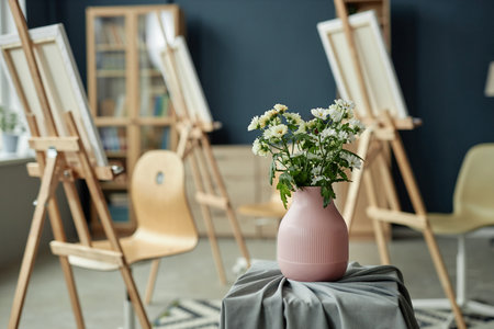 Background image of art studio with easels and floral composition in focus copy spaceの写真素材