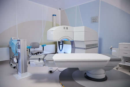 Modern operating room featuring advanced medical imaging equipment and surgical table positioned for patient procedures, sterile environment emphasizing cutting edge healthcare technologyの写真素材
