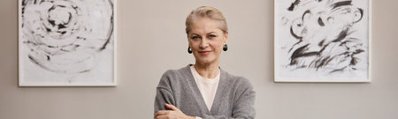 Header portrait of senior Caucasian woman standing with arms crossed, smiling confidently while...
