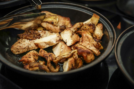 Buffet with chicken in cast iron panの写真素材