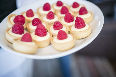 Raspberry tartlets / catering & buffetの写真素材