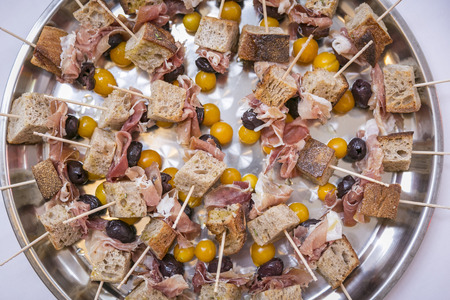 Catering / skewers with bread, ham, physalis & grapes