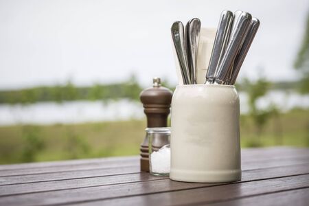Beer mug neutral with cutlery on table