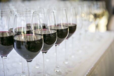 Glasses with red wine / catering & serviceの写真素材