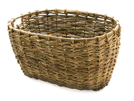 Basket in wattled from willow rods in white backgroundの写真素材
