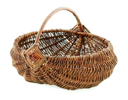 Basket in wattled from willow rods in white backgroundの写真素材