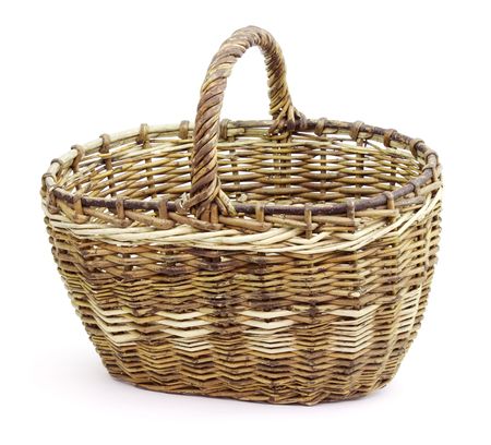 Basket in wattled from willow rods in white backgroundの写真素材