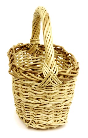 Basket in wattled from willow rods in white backgroundの写真素材