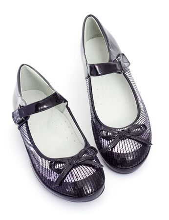 School footwear for the girl on a white backgroundの写真素材