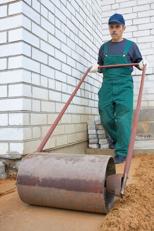 The worker prepares a place for a pavingの写真素材