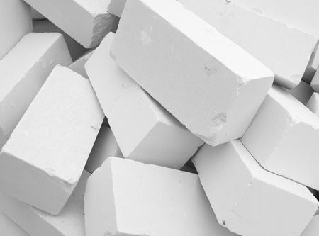 Piled up a big pile of white bricksの写真素材