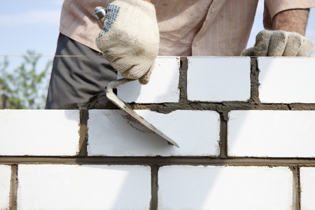 Construction of the wall of white brickの写真素材