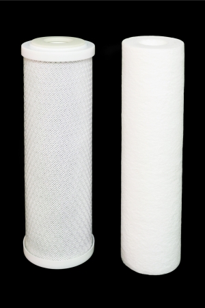 Cartridge for water filter on a black backgroundの写真素材