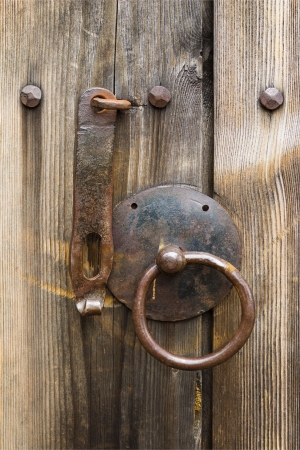 Door handle on an old wooden doorの写真素材