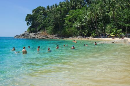 PHUKET, THAILAND  - FEB 24, 2015: People bathe in the Bay of the Andaman sea.  Many tourists prefer to come to Phuket in February. Phuket , Thailand, February 2015のeditorial素材