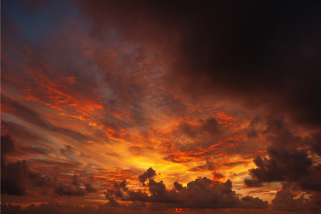 Ominous sunset , the evening sun stains the clouds redの写真素材