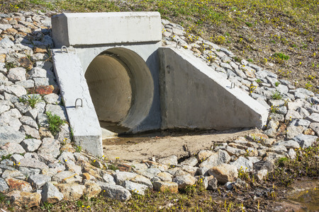 Drain pipe under the automobile road for waterの写真素材