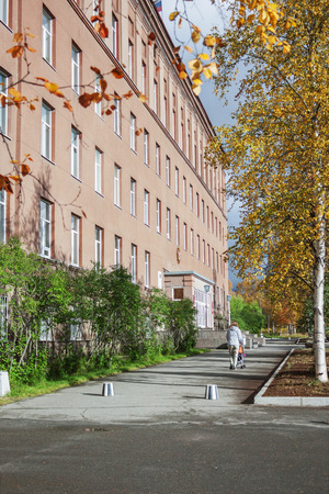 Apatity, Russia - September 14, 2012: Geological Institute and a small walkway in front of him in the city of Apatity. Autumn here comes earlyのeditorial素材