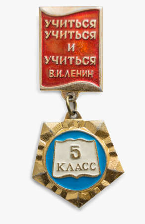 Moscow, Russia - Mar 26, 2020.: Soviet badge of school student. Inscription: Learn to learn and learn. V.I. Lenin. On suspension inscription: 5th gradeのeditorial素材