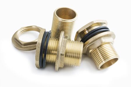 Three brass fittings with rubber washers on white backgroundの写真素材