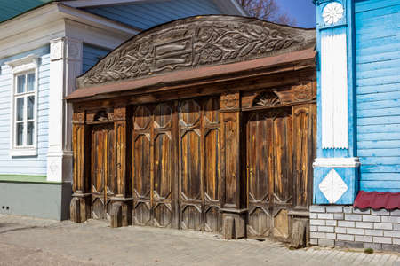 Gorodets, Russia - Apr 17, 2021: Attractions of city. Gate with ancient carvings near museum "Countess Panina House"のeditorial素材