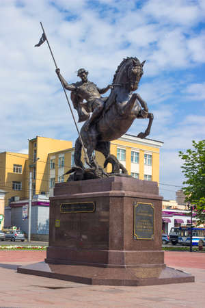 Ivanovo, Russia - Jul 16, 2013: Equestrian statue of St. George, hitting dragon, on square in Ivanovoのeditorial素材