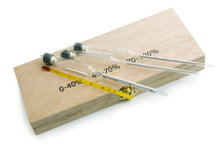 Three hydrometers for measuring degree of alcohol with case in white backgroundの写真素材