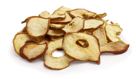 Pear dried fruits heap close up isolated on white. autumn harvestの写真素材