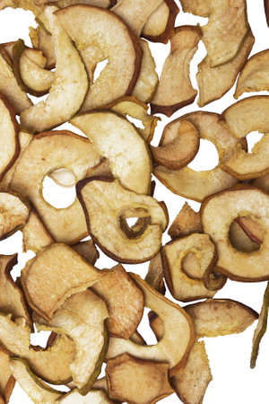 Dried pears lie on white paper. Form a beautiful backgroundの写真素材