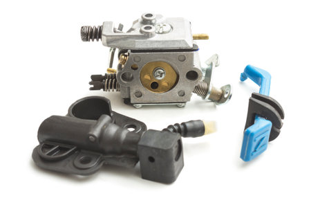 Carburetor for two stroke engine and oil pump isolated on white background