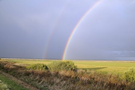 Bright rainbow after an autumn thunder-storm