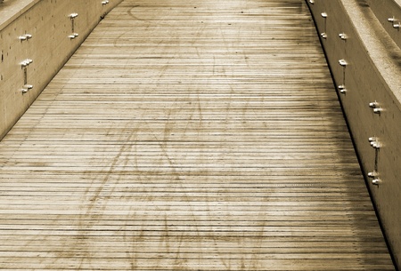 Modern wooden bridge, metal nuts. Sepia colors.の写真素材