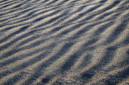 Sand texture in a beach, wind created mini dunes.