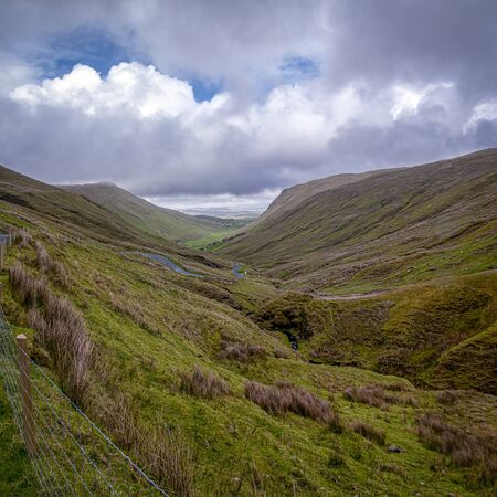 From Glencolumbkille a road heads inland towards Ardara, through the wild and picturesque Glengesh Pass where the road meanders through sloping mountainous terrain.の写真素材