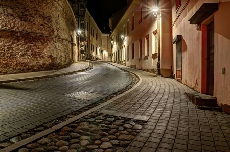 Vilnius, capital city of Lithuania. Narrow medieval street of Old Town in the night.の写真素材
