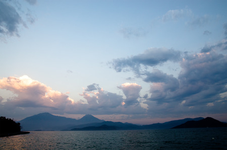 Dawn on the sea, rocky shoresの写真素材